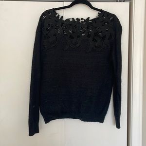 Black sweater with floral neck detail